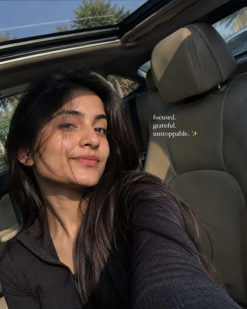 Natural candid selfie with a confident expression and a short Instagram caption