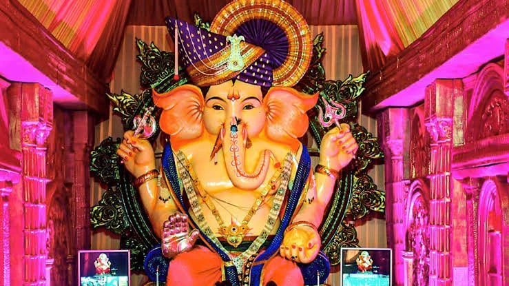 Ganpati Captions For Instagram with a beautifully decorated Ganpati idol