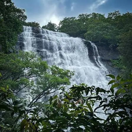 Kokan waterfall captions for Instagram featuring a lush green waterfall and peaceful nature