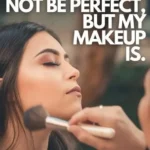 Makeup Artist Captions For Instagram: Vertical photograph of a woman with eyes closed receiving a makeup application, as a makeup brush is being applied to her face. Above her, bold white text reads "MY LIFE MIGHT NOT BE PERFECT, BUT MY MAKEUP IS.", with "THE ROAD TRIP EXPERT" branding at the bottom.