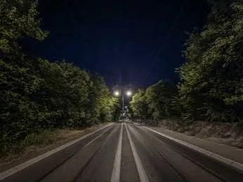 Night Ride Captions for Instagram with a peaceful highway stretching into the night