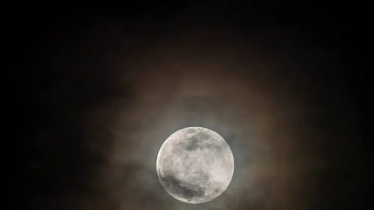  Aesthetic moon captions for Instagram featuring a crescent moon in a dark starry sky