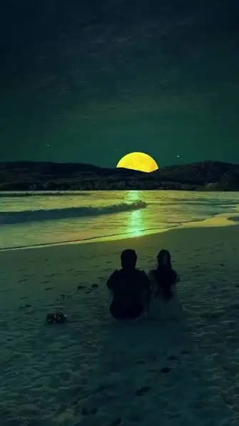 Romantic Moon Captions Instagram with a couple enjoying a moonlit night