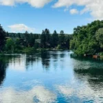 River Captions for Instagram with peaceful river and mountain scenery