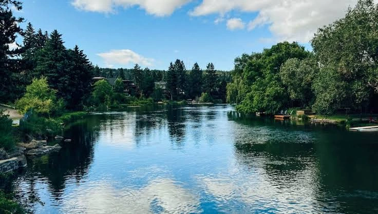 River Captions for Instagram with peaceful river and mountain scenery